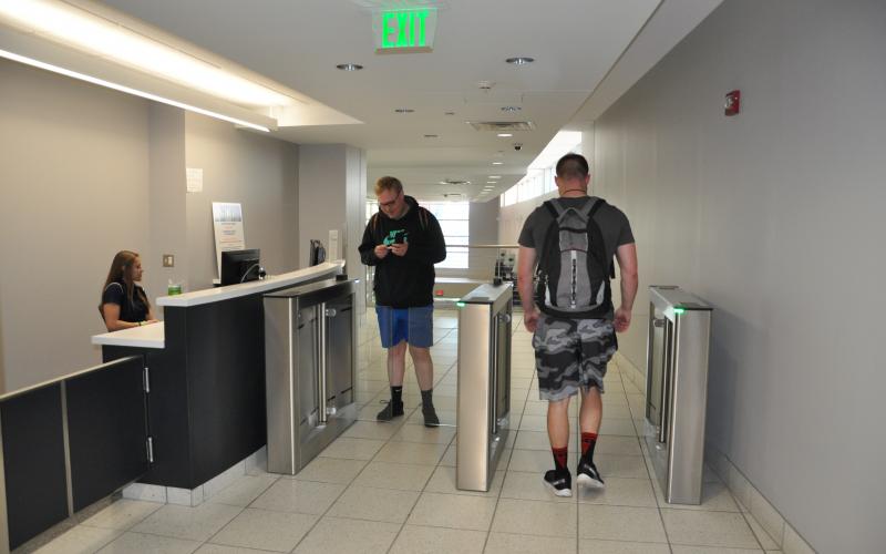 New Rec Hall entry turnstiles with a staffed control desk