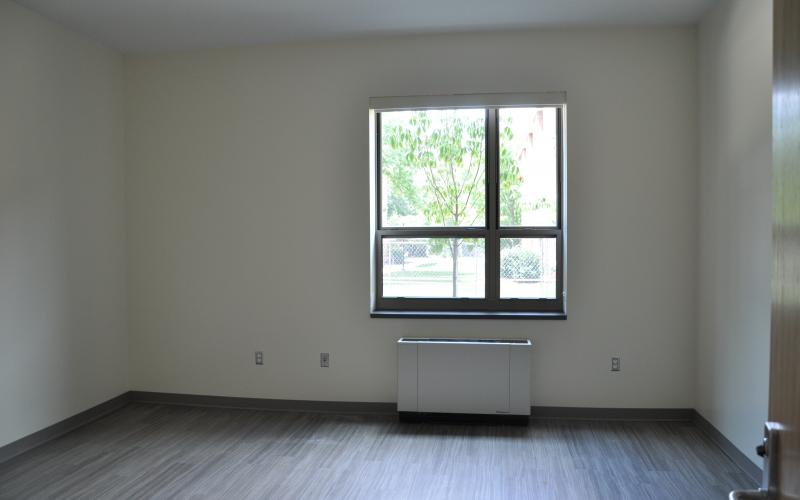 A typical triple dorm room ready for furniture delivery