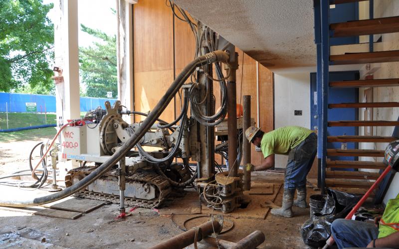 This worker is using special equipment to remove the old tile floor in Tener Hall
